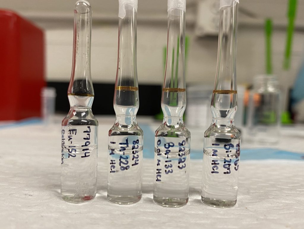 Photograph of ampoules with a small amount of liquid in each one